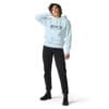 Person wearing a light blue hoodie and jeans.