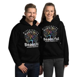Smiling couple in autism awareness hoodies.